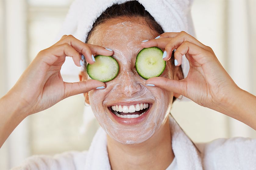 Women with cucumber on Eye