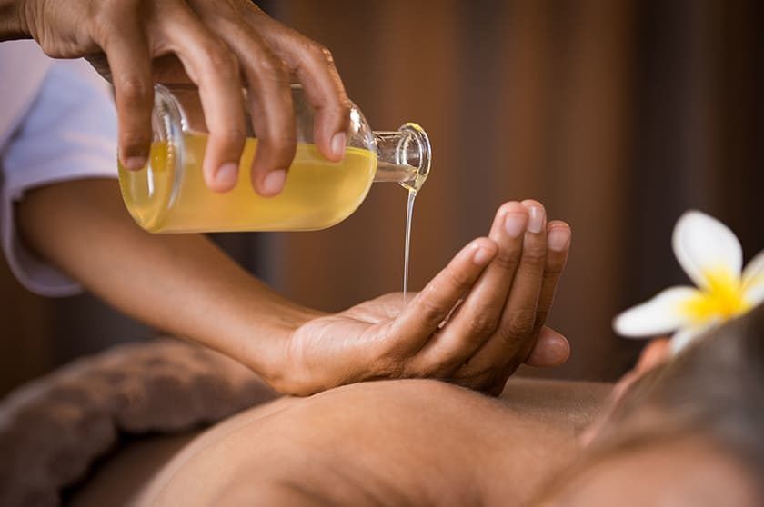 3 Women Applying oil for Body Massage